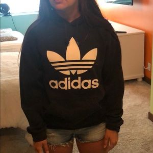 Black adidas hoodie with the logo in white